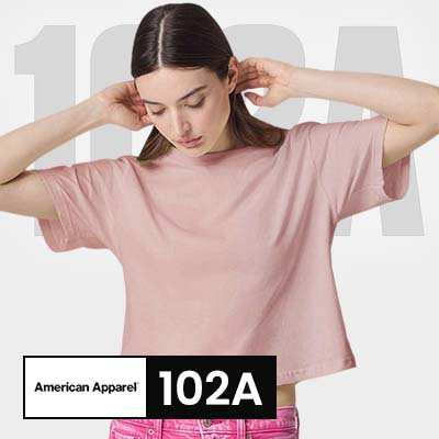 Model wearing American Apparel 102A women's boxy t-shirt in soft pink color