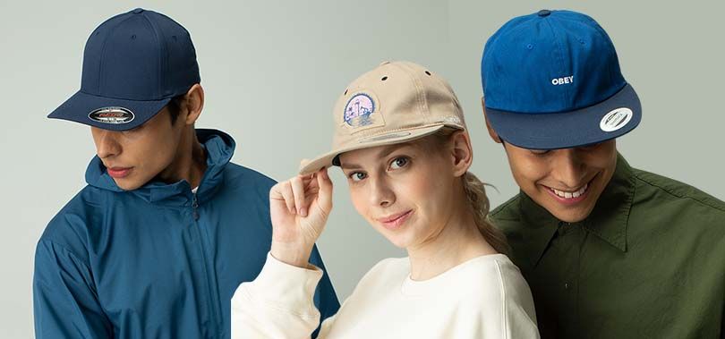 Three models wearing different branded caps showcasing the design and fit of Flexfit and Yupoong hats—ideal for streetwear, casual, and custom promotional use.
