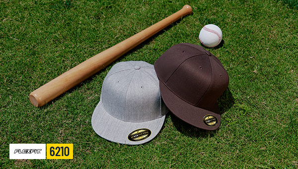 Flexfit 6210 fitted baseball caps blank structured hats on grass with sports gear