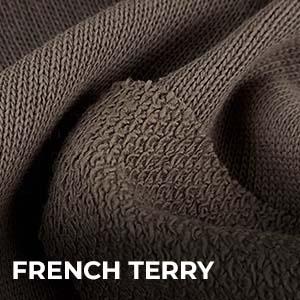 Close-up texture of French Terry fabric showing smooth front and looped back knit