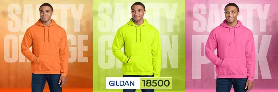 American man wearing Gildan 18500 hooded sweatshirt in Safety Orange, Safety Green, and Safety Pink colors side by side — showcasing ANSI safety color hoodies for visibility and warmth.