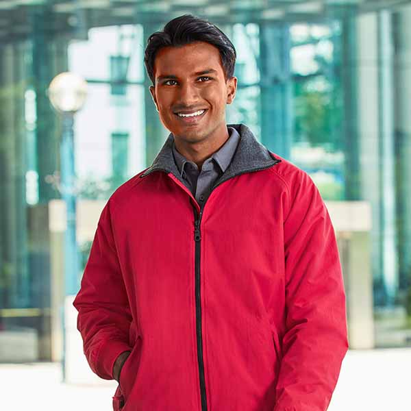 man wearing red lightweight jacket with grey collar corporate casual outerwear