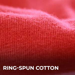 Close-up view of red ring-spun cotton fabric showing smooth and soft knit texture